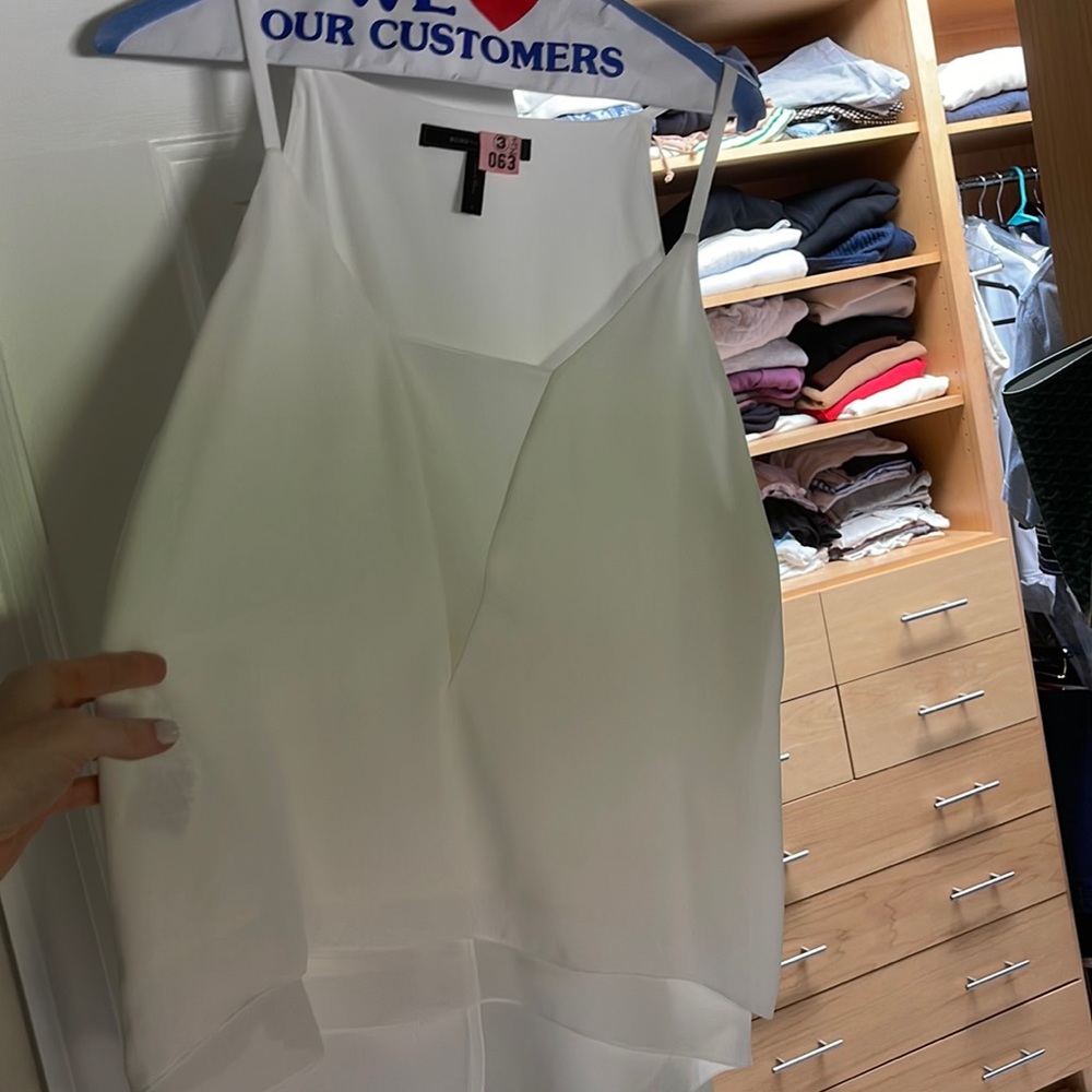 White sleeveless BCBG blouse with split detail back